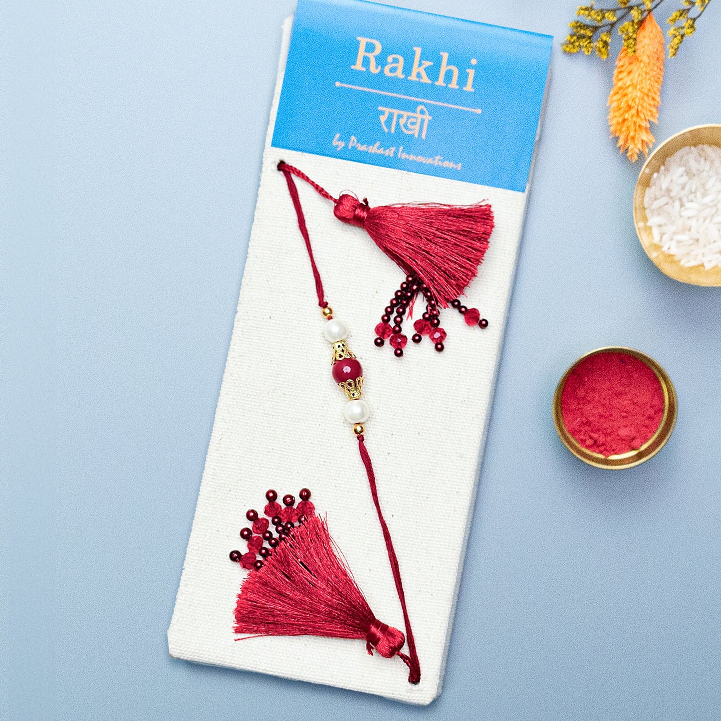 Handmade Lumba Rakhi: Red with Crystal and Fringes